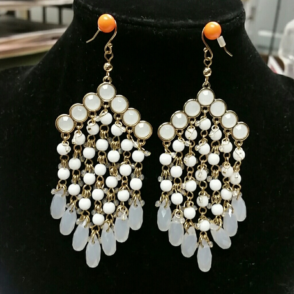 Gold tone and white chandelier earings.